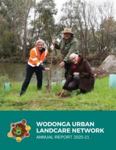 Annual report cover - tree planting by the river.